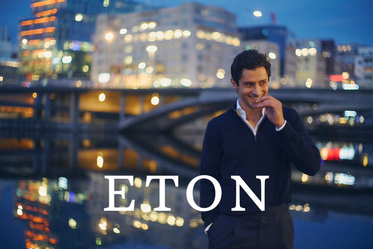 ETON fall 2026 – man in a navy knit against city lights at night